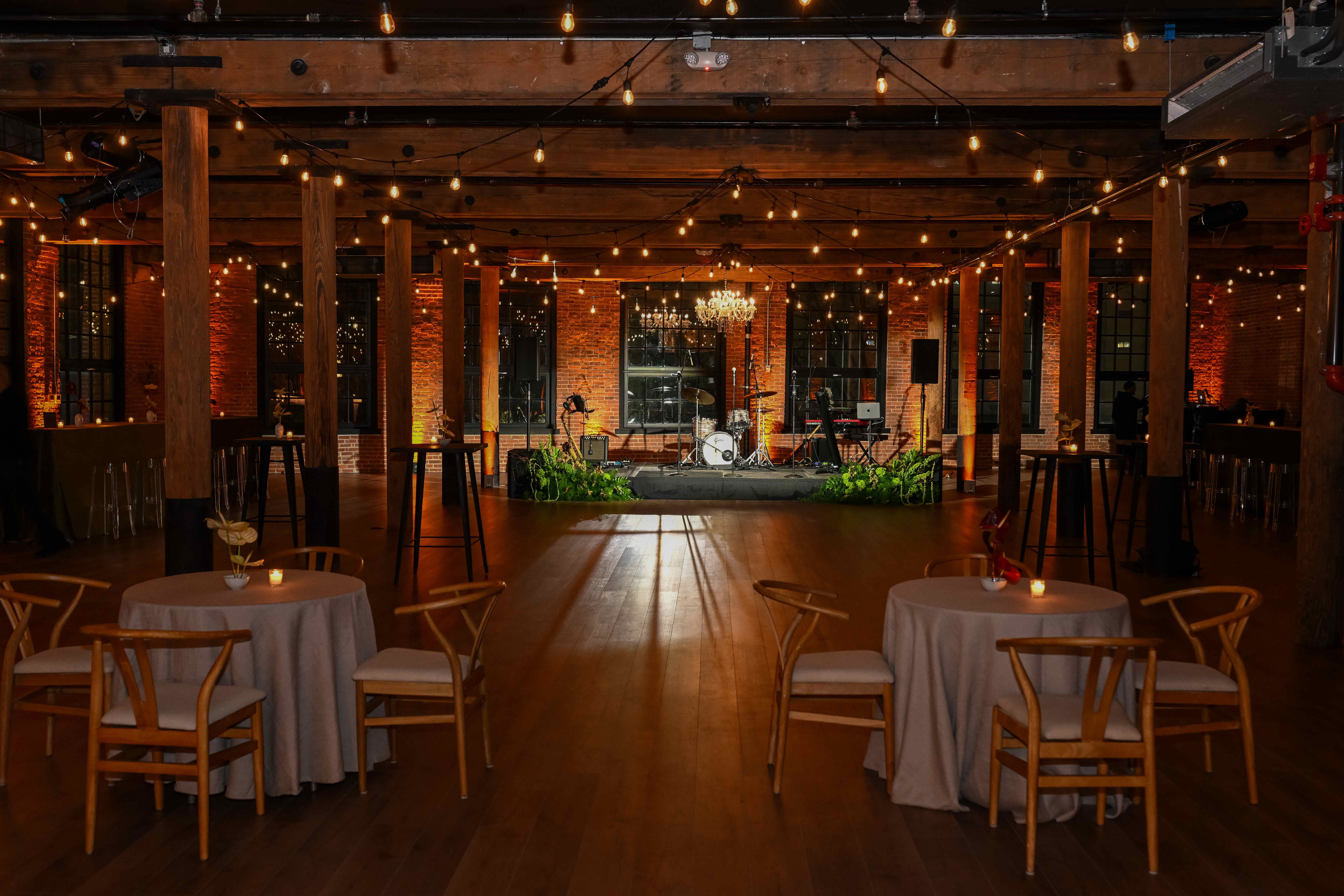 The Main Event Space with stage and atmospheric lighting