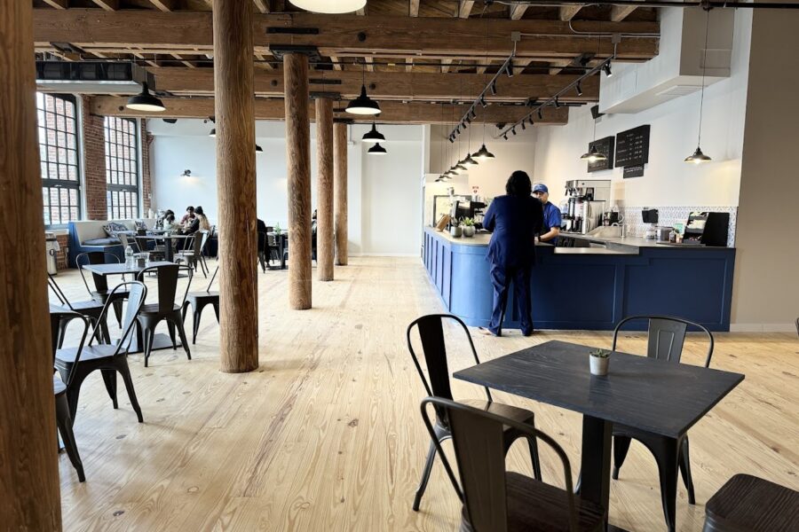 Kitchen at the Mills cafe space with modern blue counter and industrial design