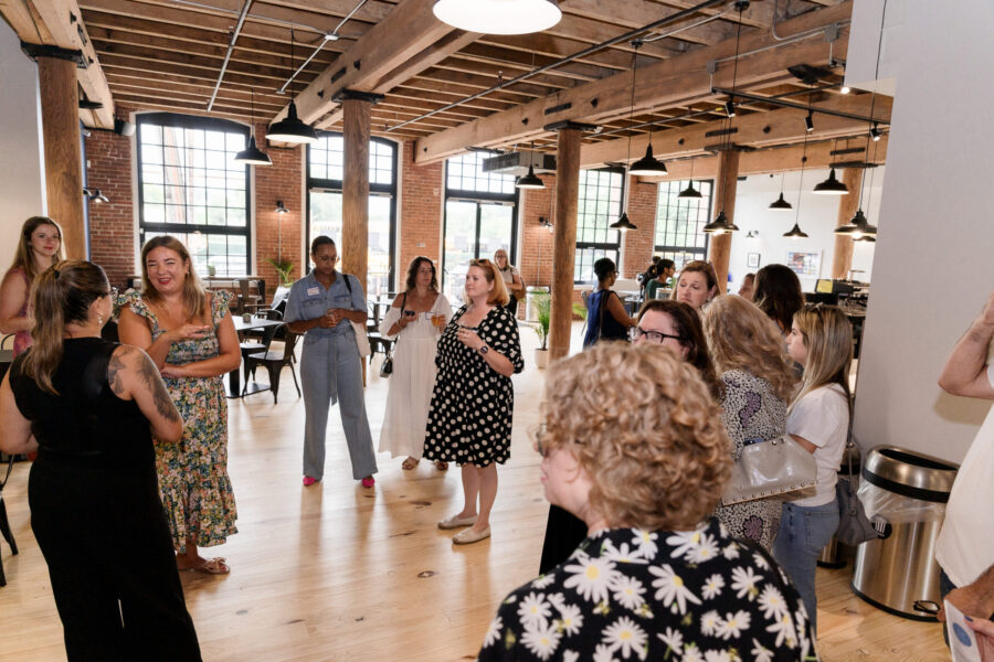 Group event and networking at Kitchen at the Mills with exposed brick walls