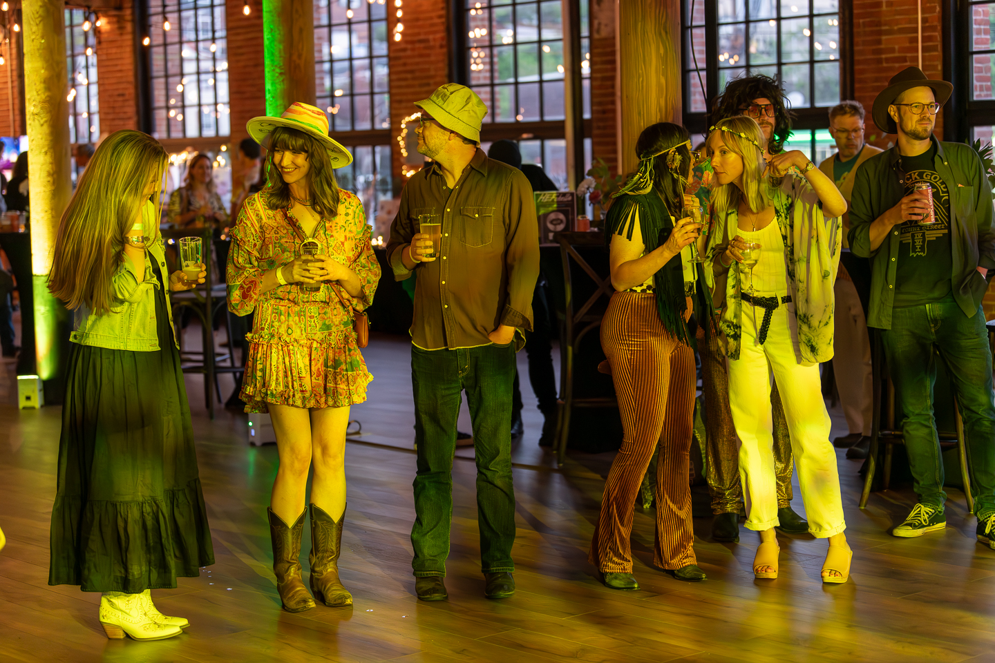Themed party event at The Mills with guests in vintage costumes enjoying drinks in the industrial venue space